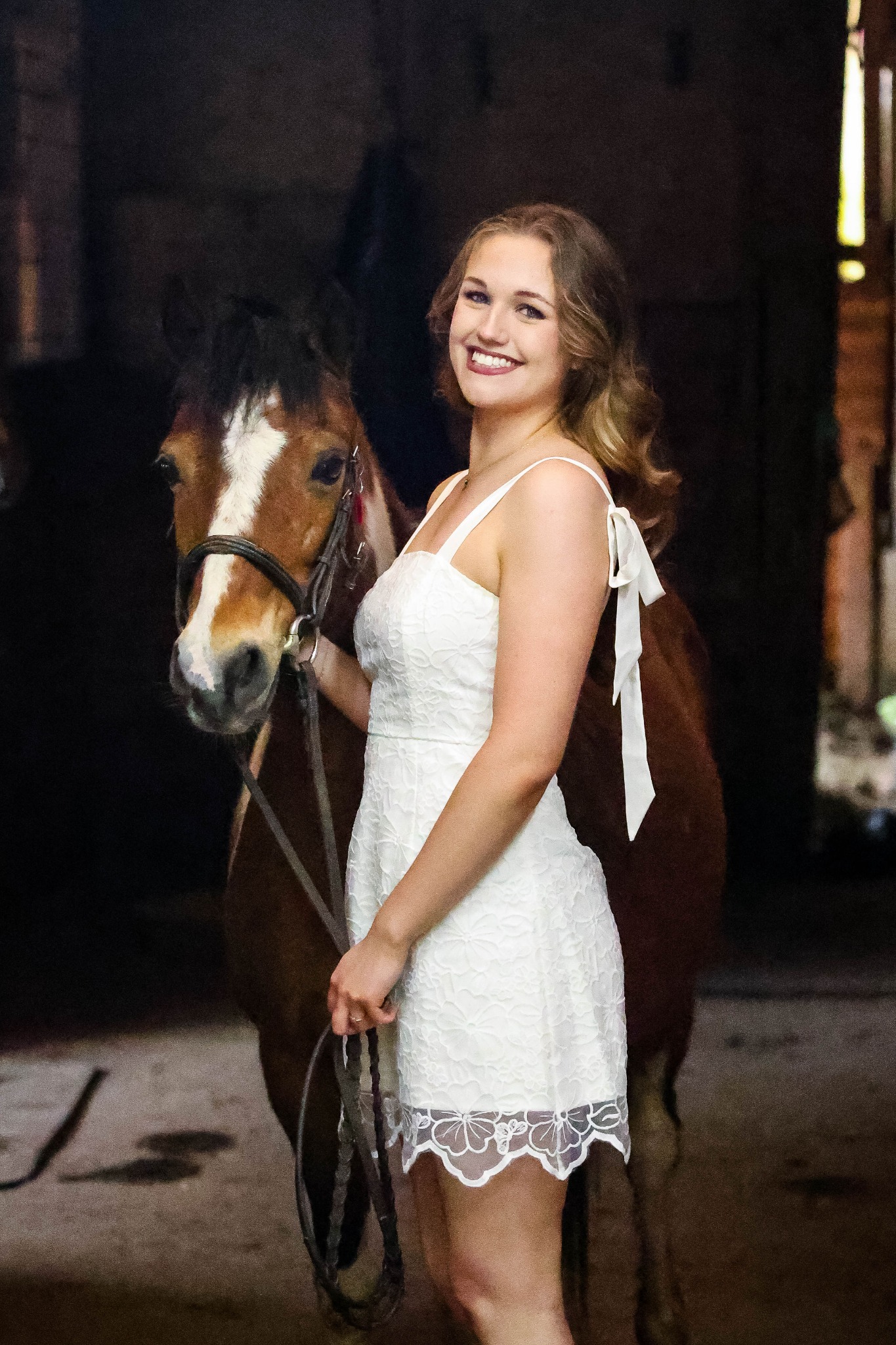 Isabelle Roberts standing beside a horse